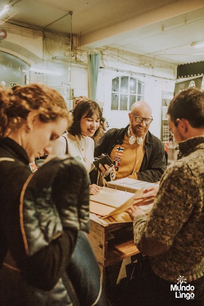 Participants sharing conversation at a table in Portugal