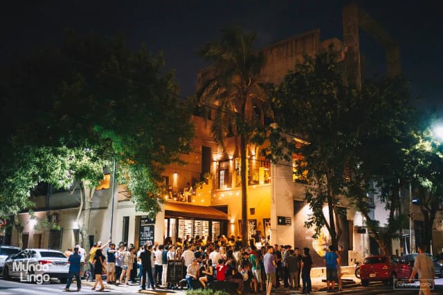 Cozy bar interior with warm lighting and flowers